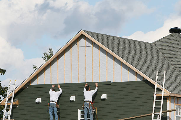 Professional Storm Damage Siding Repair technician working in Dennison, OH